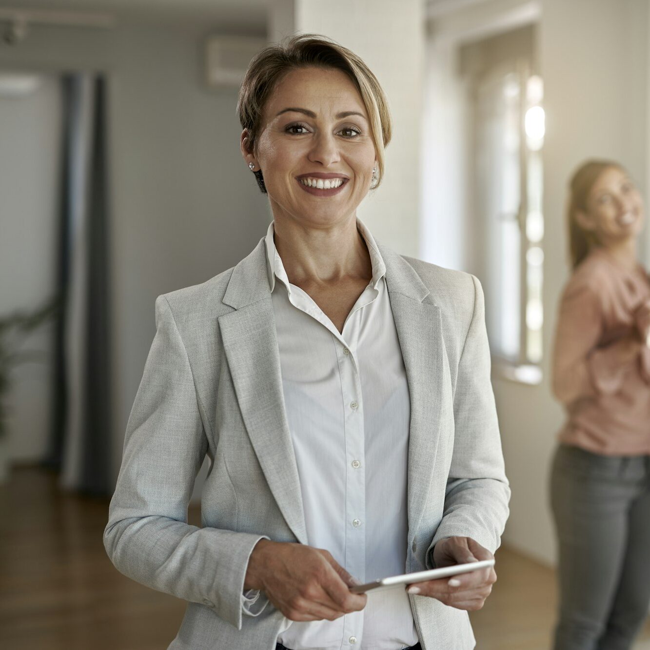 Portrait of happy female real estate agent.